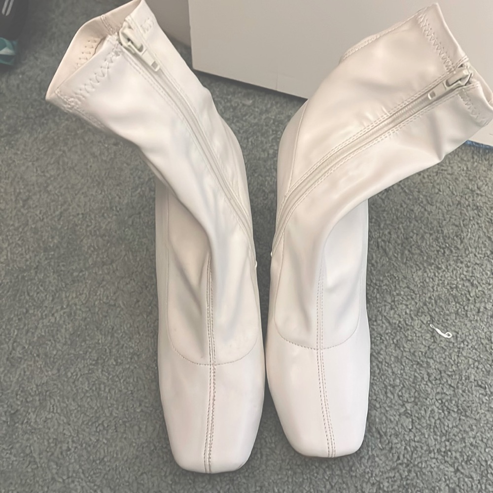 White leather ankle booties